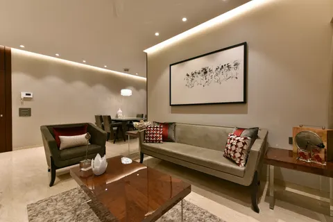 Living room with a large framed artwork above the sofa, showing how artwork can belong naturally to a settled room.